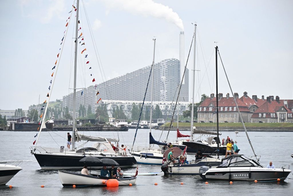 Spectators on boats moored close to the race route look on during the 1st stage of the 109th edition of the Tour de France cycling race 132 km individual time trial stage in Copenhagen on July 1 2022 Photo by AnneChristine POUJOULAT AFP Photo by ANNECHRISTINE POUJOULATAFP via Getty Images