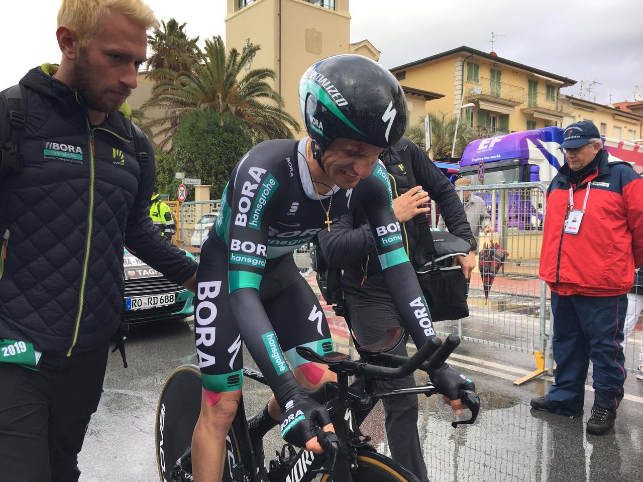 Rafal Majka in obvious pain after being hit by pedestrian in team time trial