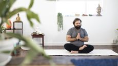 Man holding yoga pose