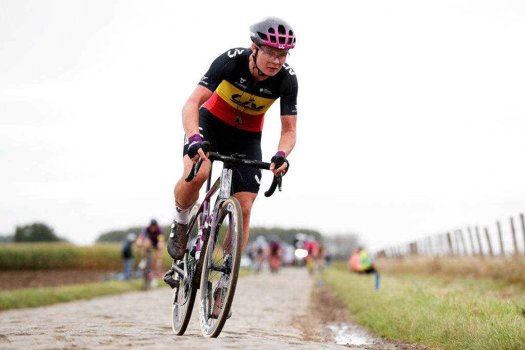 Lotte Kopecky (Liv Racing) chases after a puncture in Paris-Roubaix