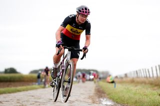 Lotte Kopecky (Liv Racing) chases after a puncture in Paris-Roubaix