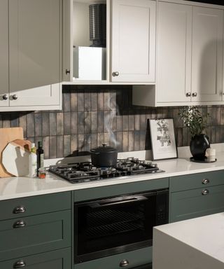 green and white kitchen with cupboard above cooker open showing Plasma filter attached to cooker hood