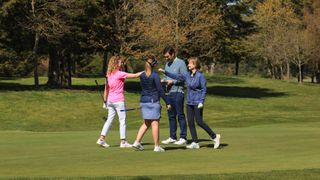 Golfers celebrating on green