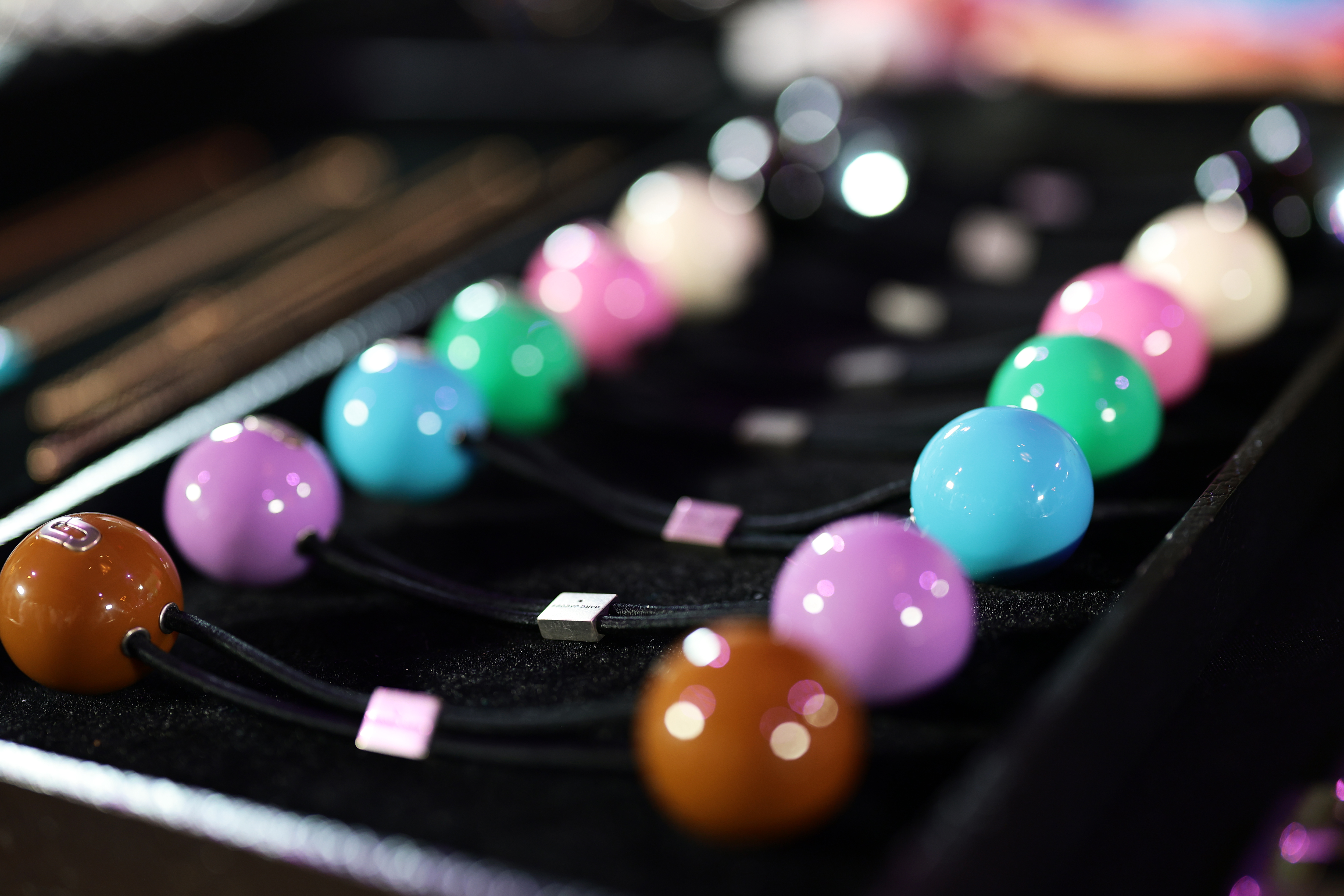 plastic hair ties on a black tray