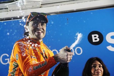 Stage winner and overall Pais Vasco champion Sammy Sanchez celebrates with some champagne.