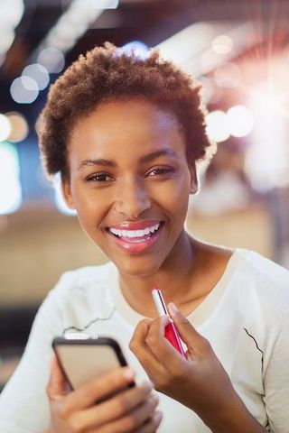 Facial expression, Smile, Skin, Lip, Beauty, Gadget, Eyebrow, Smartphone, Electronic device, Mobile phone,