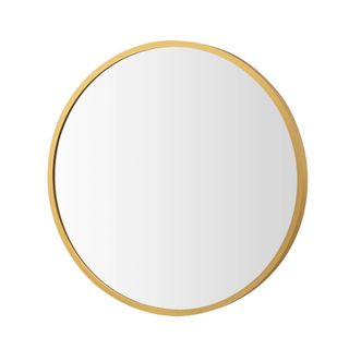 A circular gold mirror
