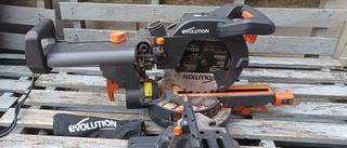 Evolution R210 SMS Plus mitre saw on grey wooden pallets