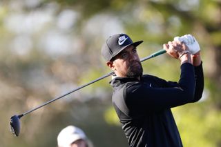 Tony Finau watches his tee shot with a driver