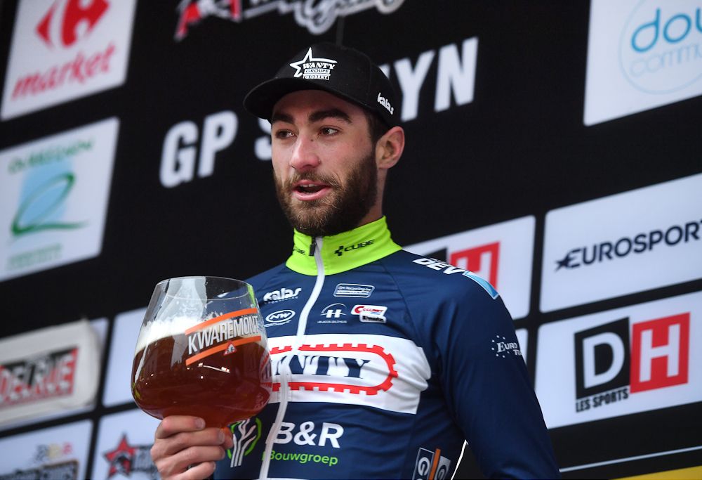 2017 Le Samyn winner Guillaume Van Keirsbulck enjoys a beverage on the podium