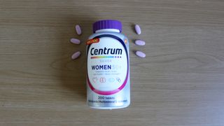Container of Centrum Silver Women 50+ laid on a table