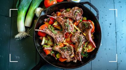 Cast iron black dish of meat and vegetables, a key part of the paleo diet