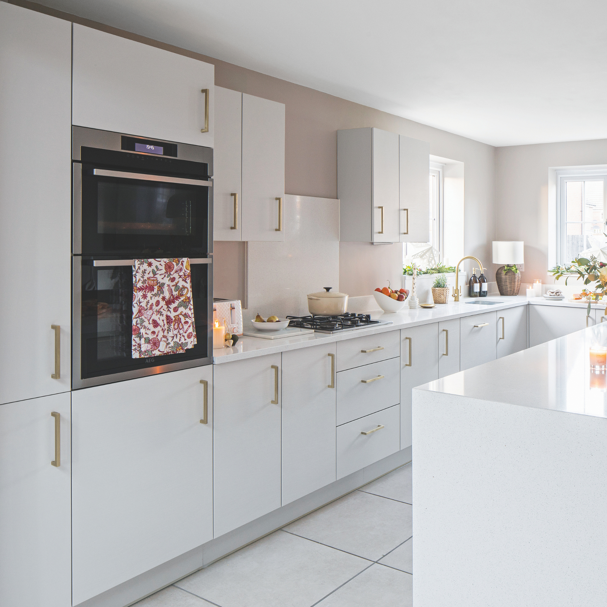 Modern white kitchen cabinets with gold accents
