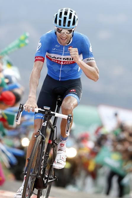 Ryder Hesjedal (Garmin-Sharp) gives a salute to victory after climbing La Camperona