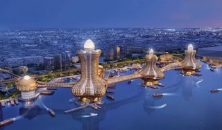 Three bejewelled towers, linked by waterways, across the coastline of Dubai