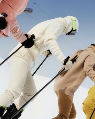 Skiiers wearing Extreme Cashmere colourful knitwear on slopes