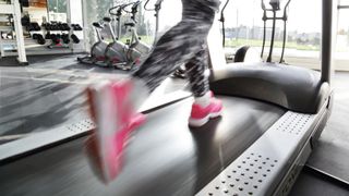 Is treadmill running easier than outdoor running: image of runner's feet on treadmill
