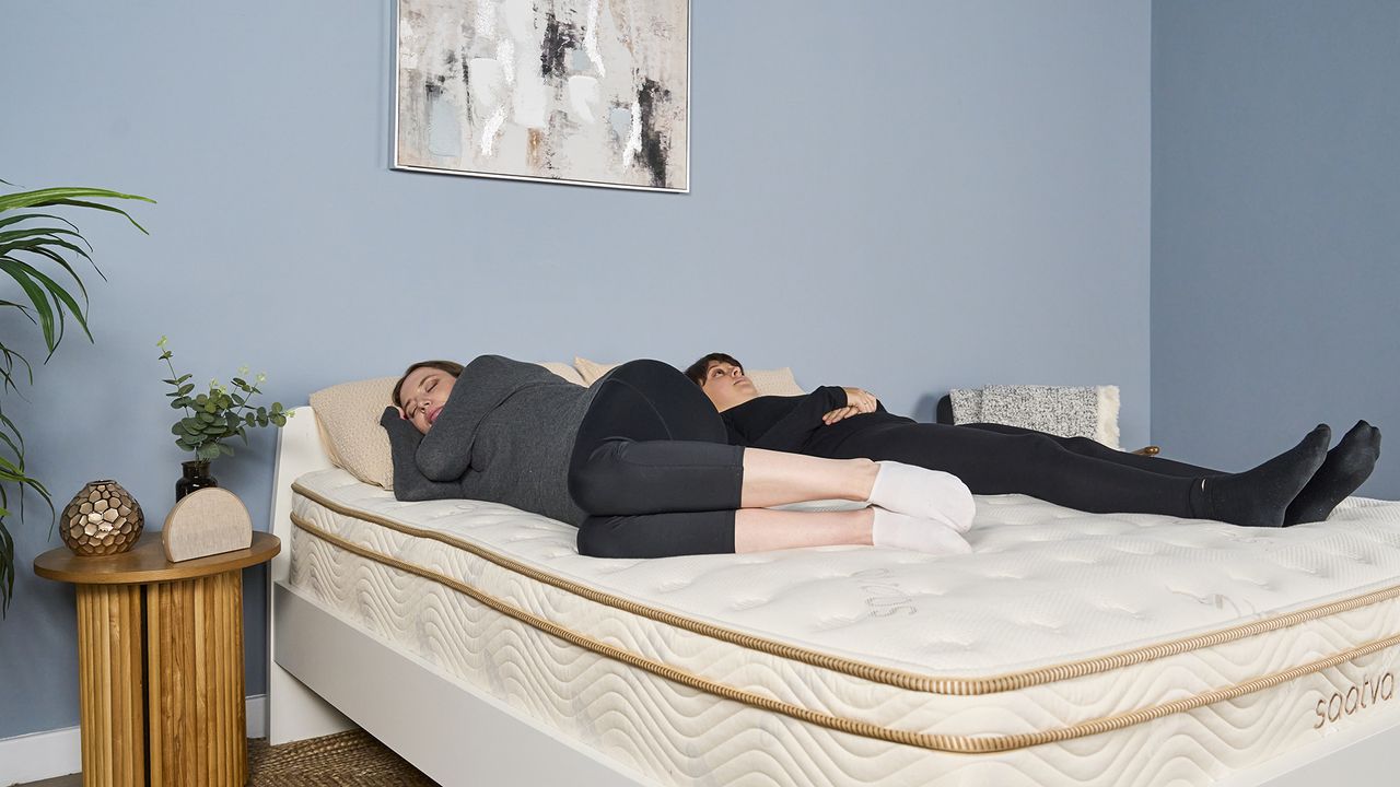 Two of our mattress testers lie on the Saatva Classic during our reviewer-led motion isolation test. Tester A performed a series of standardized physical actions, while Tester B remained lying down on the mattress, dictating notes to our Sleep Lab Lead Claire Davies on any motion she was feeling while Tester A moved around, performing light to very vigorous movements.