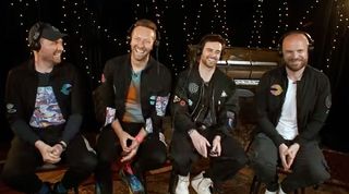 The members of the rock band Coldplay react to astronaut Thomas Pesquet of the European Space Agency aboard the International Space Station on May 6, 2021. From left to right, Jonny Buckland, lead guitarist; Chris Martin, lead singer; bassist Guy Berryman; and Will Champion, drummer.