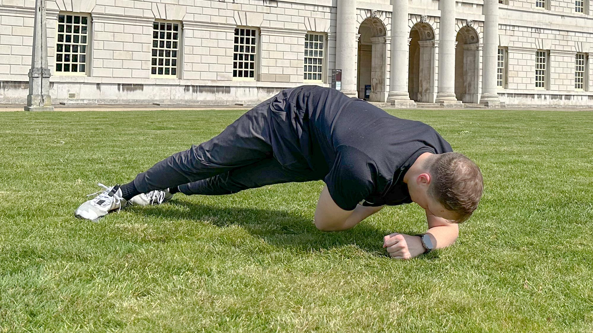 Ollie Thompson performing a side plank rotation