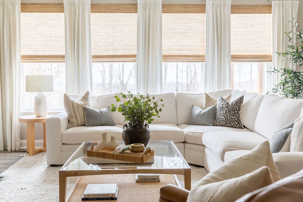 beige living room with corner sofa and cream curtains