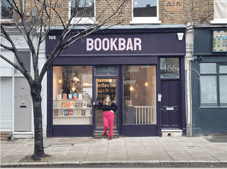 Bookbar owner, Chrissy Ryan in the doorway of Bookbar in London