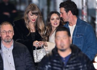 Taylor Swift shows off an allegedly new ring to Keleigh Teller and her husband, Miles.