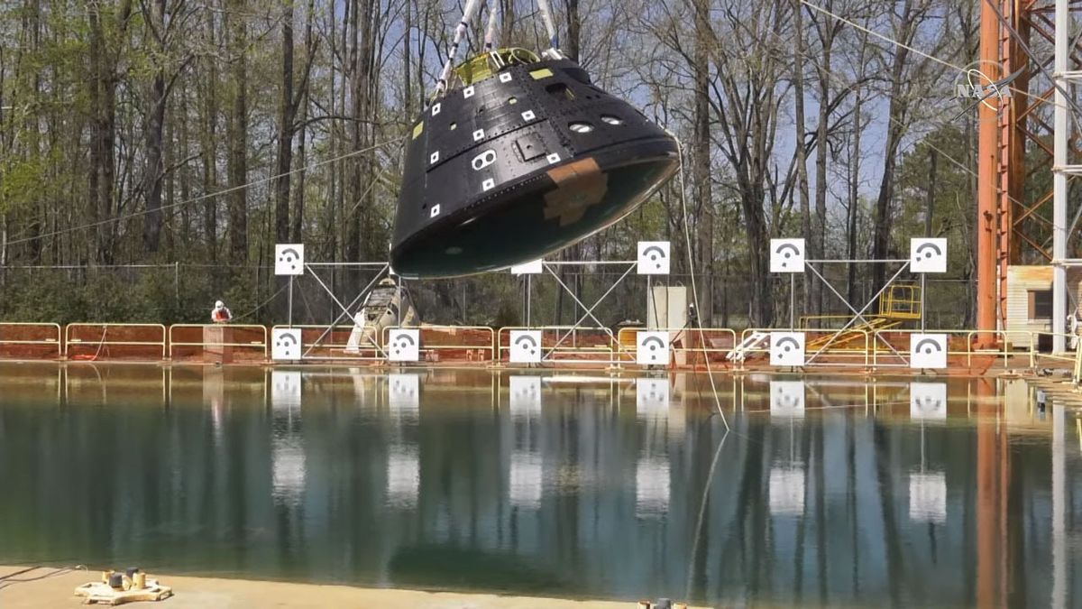 The Orion test article hangs over the Hydro Impact Basin at NASA's Langley Research Center, ahead of its planned drop test on April 6, 2021.