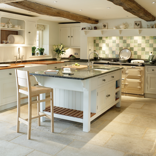 kitchen with kitchen island and kitchen island units and martin moore stone floor