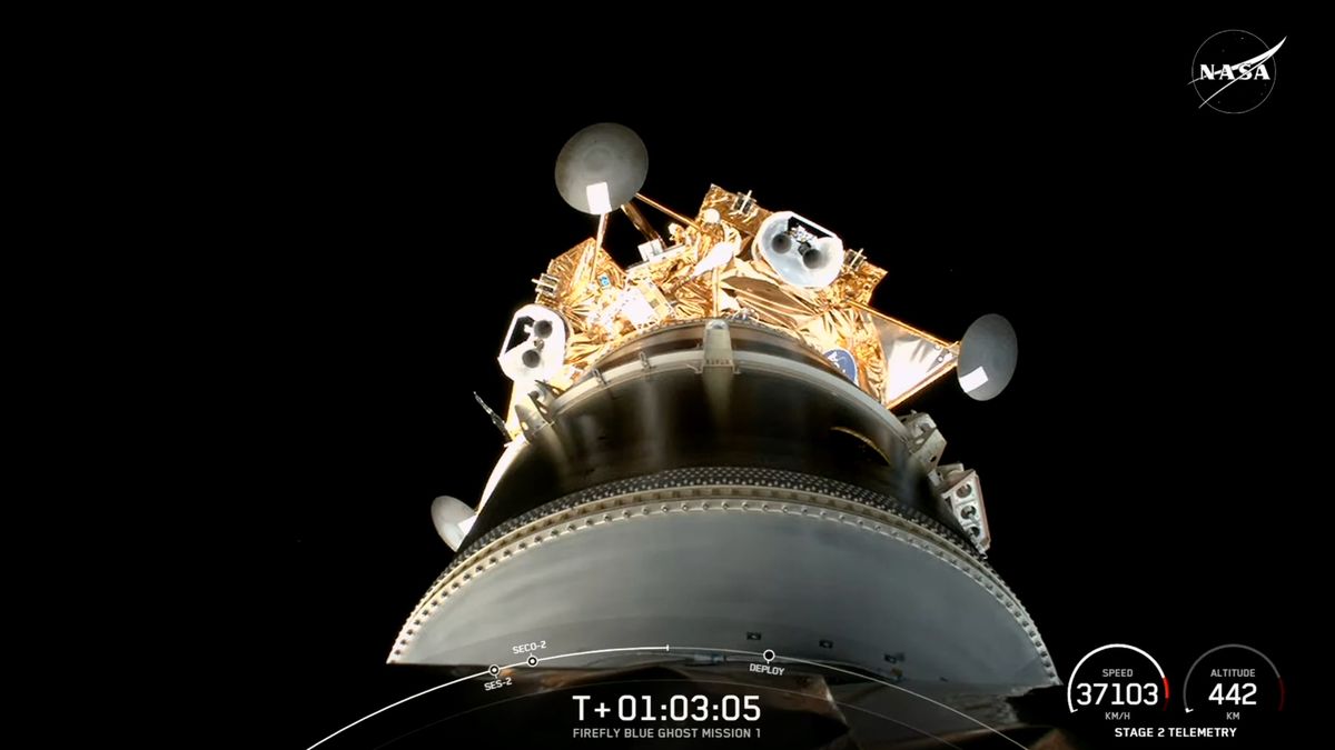 a golden spacecraft is seen against the blackness of space, still attached to the upper stage of its spacex falcon 9 rocket