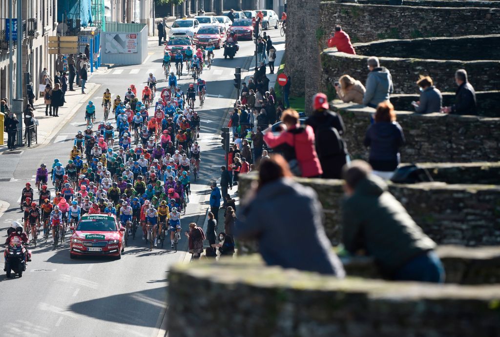The pack rides in Lugo during the 14th stage of the 2020 La Vuelta cycling tour of Spain a 2047km race from Lugo to Ourense on November 4 2020 Photo by MIGUEL RIOPA AFP Photo by MIGUEL RIOPAAFP via Getty Images