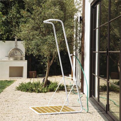 an outdoor shower in a Mediterranean garden