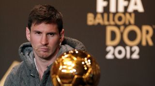 ZURICH, SWITZERLAND - JANUARY 07: Lionel Messi of Barcelona watches Ballon d'Or trophy during the Press Conference with nominees for World Player of the Year and World Coach of the Year for Men's Football on January 7, 2013 at Congress House in Zurich, Switzerland. (Photo by Christof Koepsel/Getty Images)