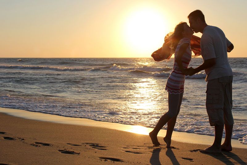 couple kissing on the beach