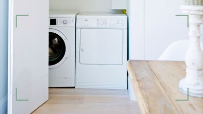 white kitchen through to a white laundry room with washing machine and dryer to support expert advice on the best time of day to do laundry
