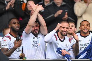 Derby County players celebrate after winning promotion to the Championship in April 2024.