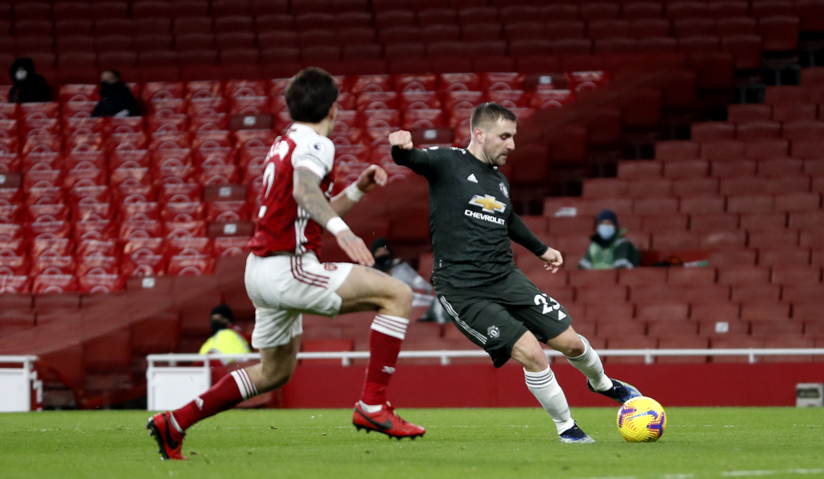 Luke Shaw, right, crosses against Arsenal