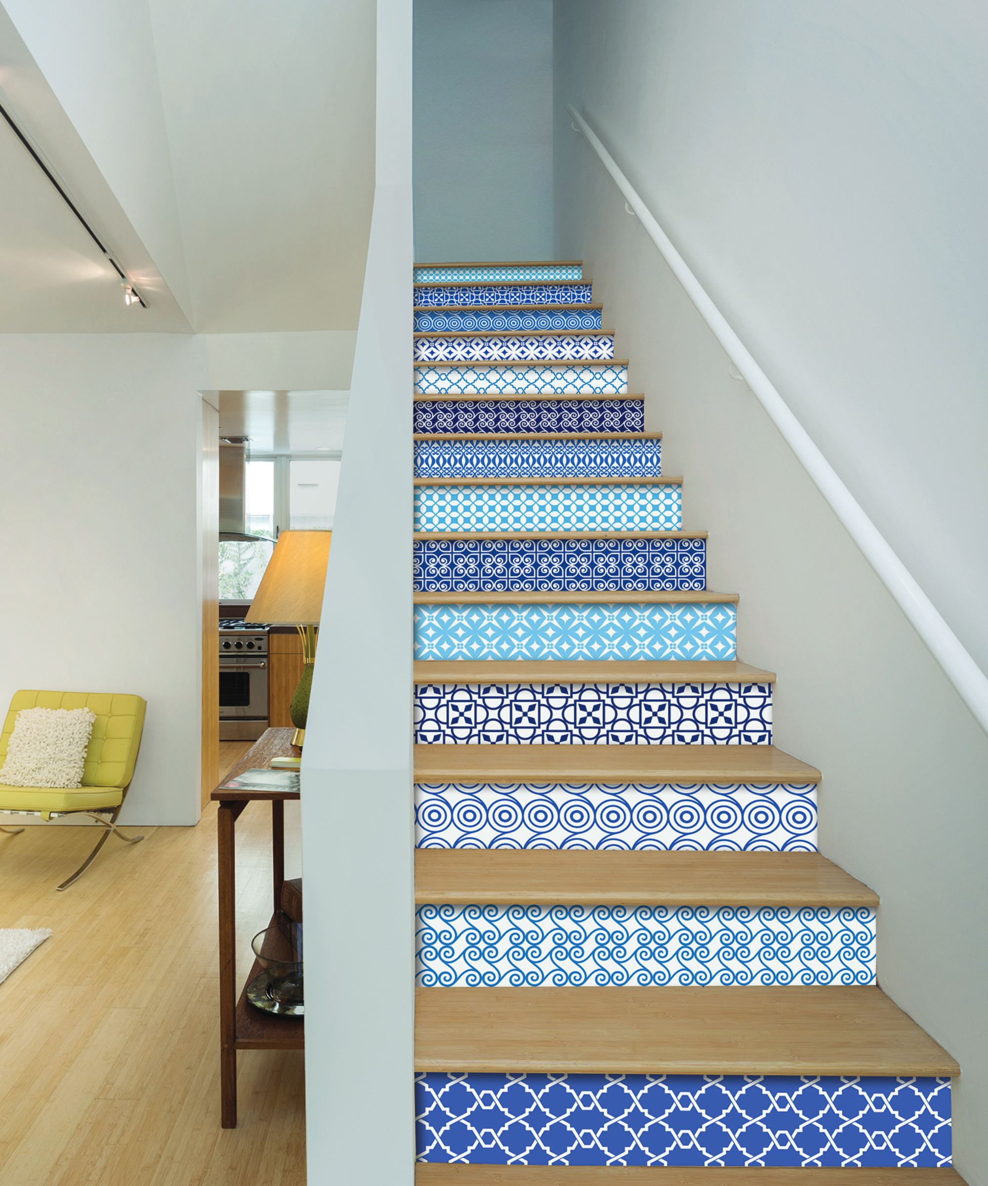 stairs with blue painted bannister, wooden treads and blue and white patterned risers