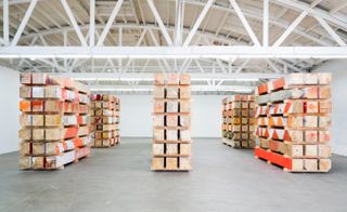 Stacks of pine beams painted to resemble traffic barricades