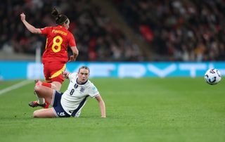 England's Grace Clinton challenges Spain's Mariona Caldentey during the UEFA Women's Nations League 2024/25 Grp A3 MD2 match between England and Spain at Wembley Stadium on February 26, 2025 in London, England.