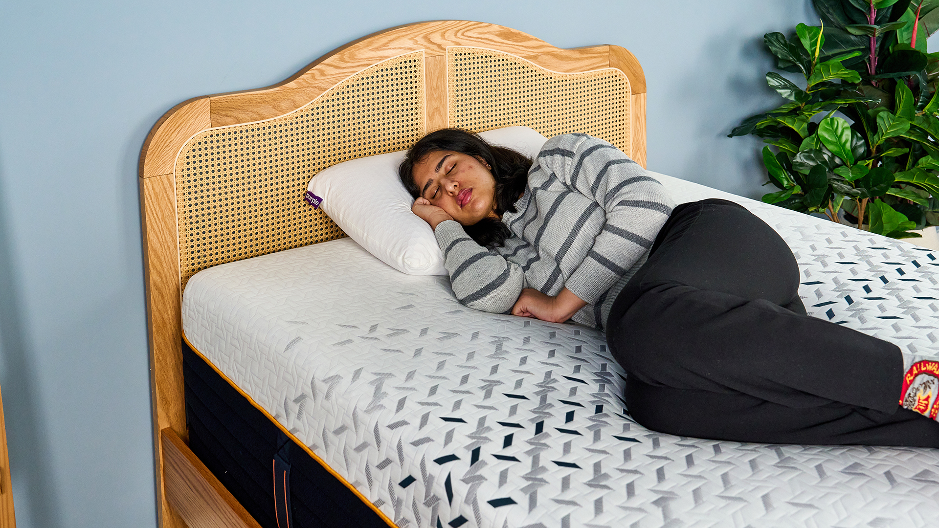 A female Tom's Guide mattress tester sleeping comfortably on her side on the Nectar Ultra Hybrid mattress