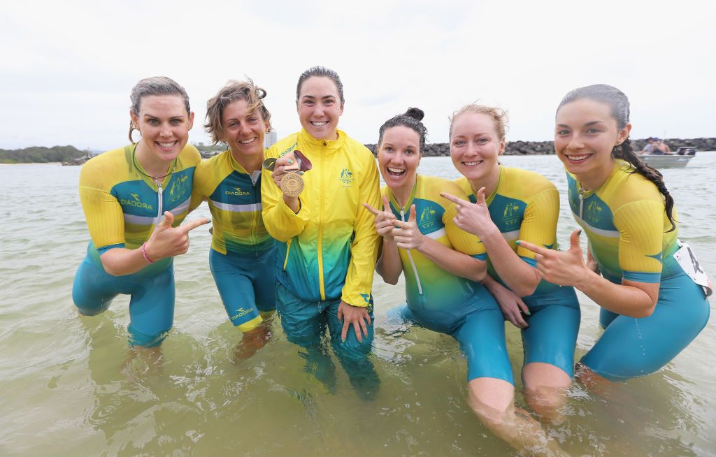 The Australia team celebrate in the ocean