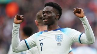 Bukayo Saka celebrates after scoring England's second goal against Ukraine in March 2023.