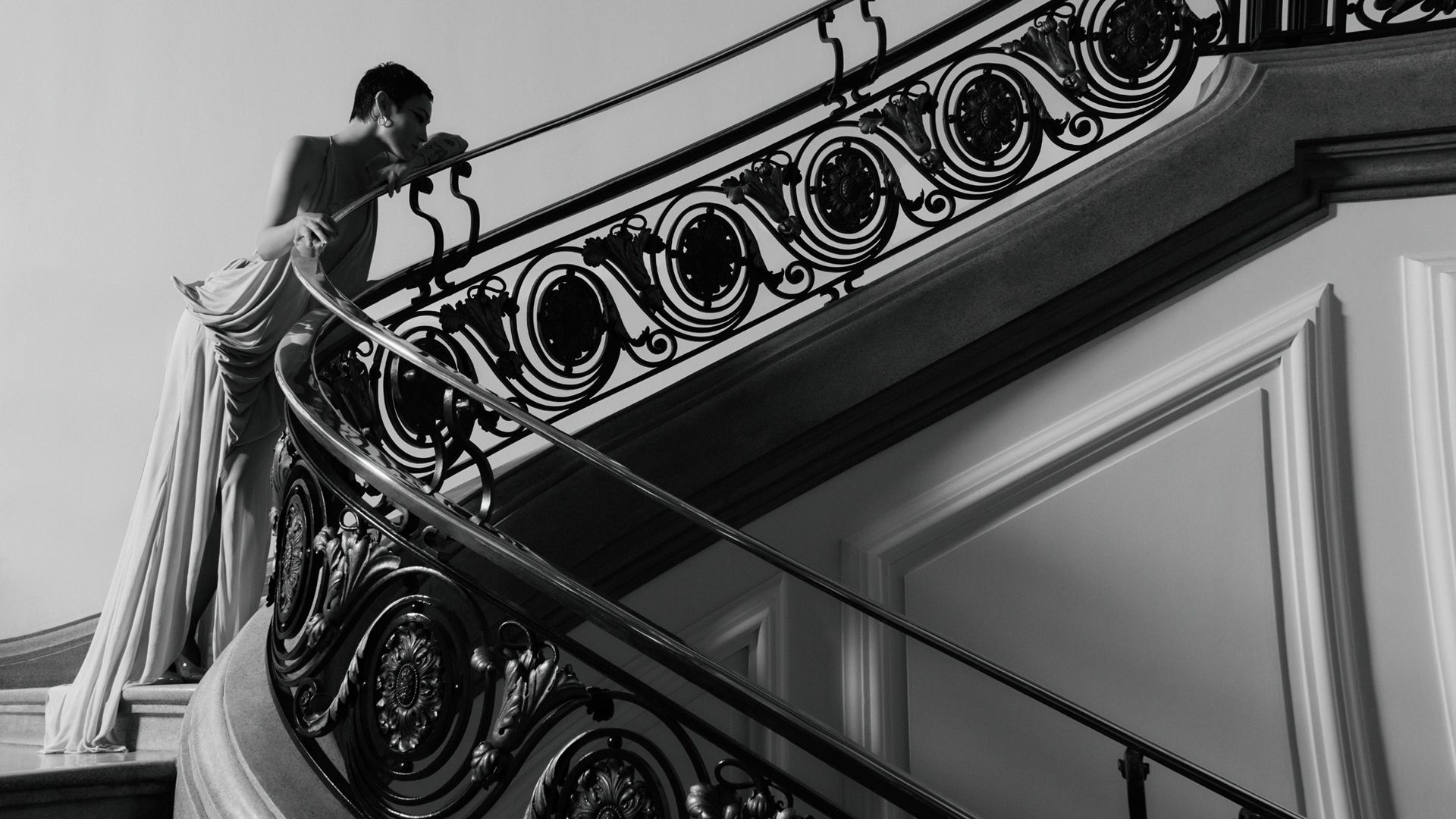Model in evening dress on stairs