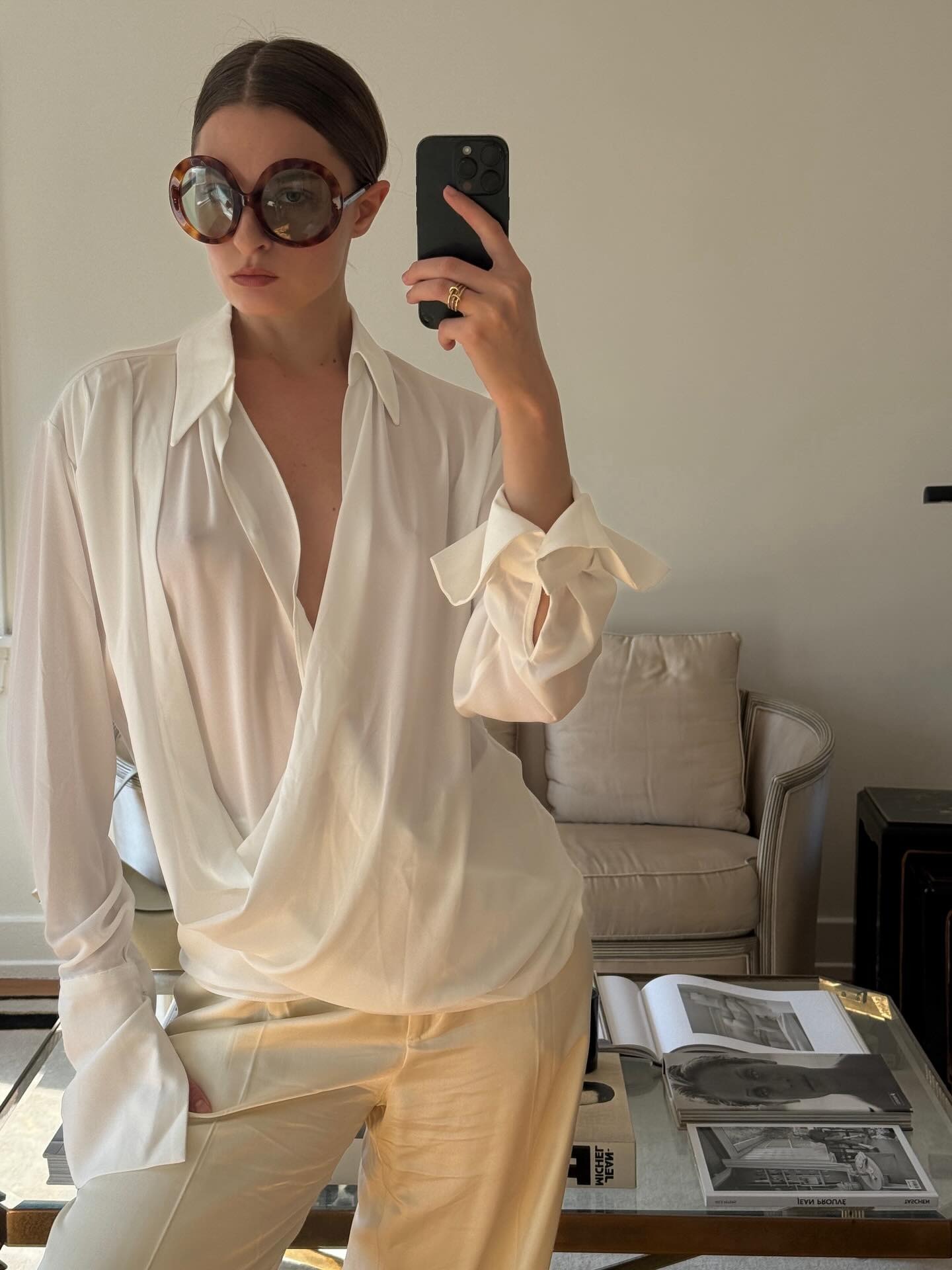 Woman takes a selfie wearing Celine's Disc Sunglasses.