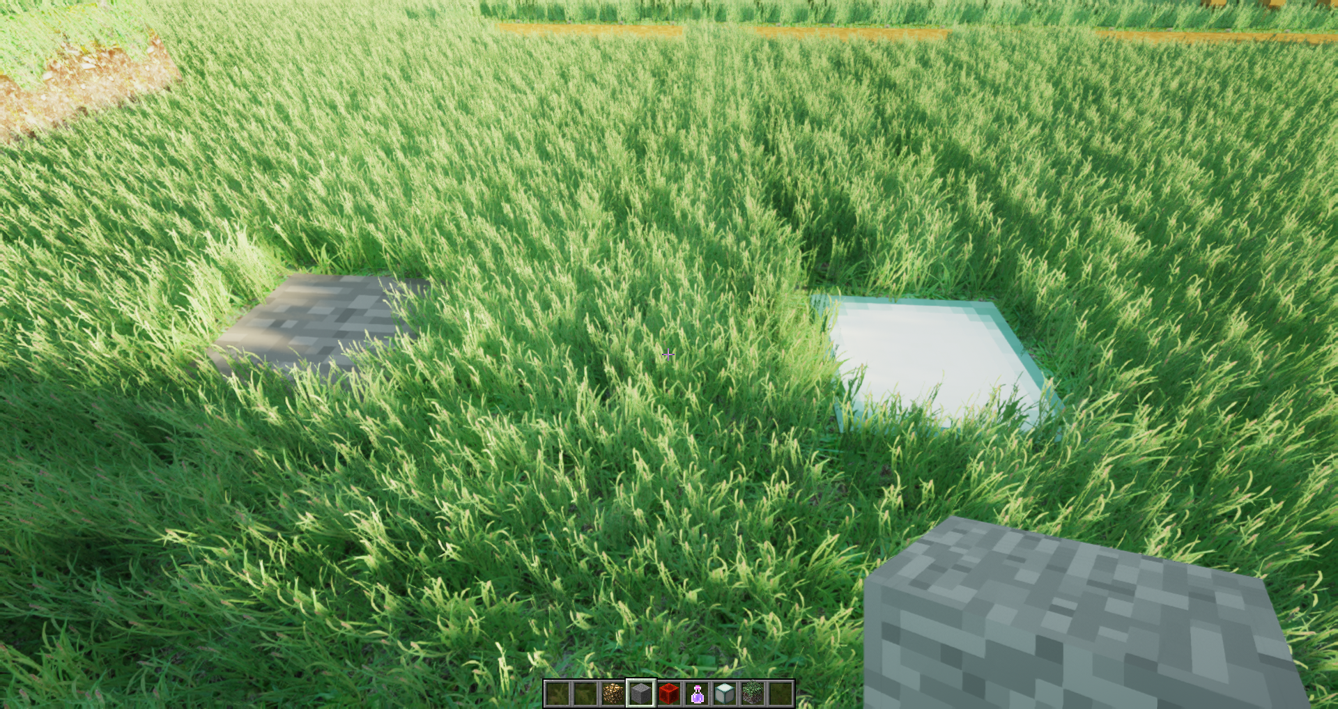 Ultra realistic grass texture pack in Minecraft next to two vanilla blocks