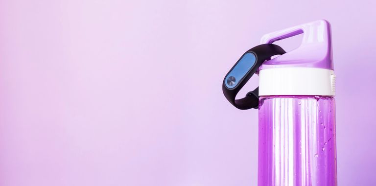 best Reusable Water Bottle - close-up of water bottle Against Purple Background