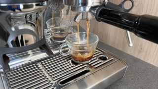 espresso being made in a chrome machine