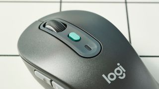 A black Logitech Signature AI Edition M750 wireless mouse