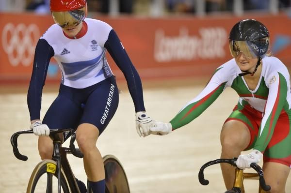 Britain's Victoria Pendleton (L) and Lithuania's Simona Krupeckaite shake hands after the former won their London 2012 Olympic Games women's sprint quarterfinal
